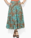 Intricate paisley on soft woven cotton exudes rich femininity in a flowing, tiered, long silhouette.