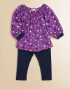 A mod-inspired, colorful polka dot print adorns a gathered tunic and paired with matching leggings for a charming set. Tunic Gathered elasticized round necklineLong puff sleevesPullover style Leggings Elastic waistband47% pima cotton/47% modal/6% spandexLeggings: RayonMachine washImported