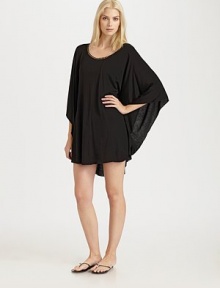 A feminine round neckline, well-placed seams and flirty ruffle details complement the relaxed fit of this design.Stylized round neckDolman sleevesPull-on styleRuffle detailsRayonHand washImported A feminine round neckline, well-placed seams and flirty ruffle details complement the relaxed fit of this design.Stylized round neckDolman sleevesPull-on styleRuffle detailsRayonHand washImported