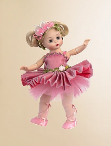 This fully-articulated Wendy doll has blue eyes and side-parted ivory hair styled into looped pigtails and decorated with a pink butterfly headband that is embellished with pink ribbon and white pearls. Her tutu of pink metallic organza over salmon colored charmeuse features a pleated skirt and pink tulle underskirt. The bodice of Butterfly Ballerina's dress is accented by a pink, green, and tan flower trim at the neckline and two trims at the waist.