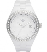 adidas glams up the classically sporty style of this Cambridge watch with crystals. White polyurethane strap and round plastic case. Silver tone bezel embellished with crystal accents. White grid-patterned dial features silver tone stick indices, minute track, date window at three o'clock, three hands and logo at twelve o'clock. Quartz movement. Water resistant to 50 meters. Two-year limited warranty.