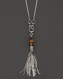 Sterling silver is a chic setting for a striking bamboo bead, horsebit detailing and a tassel. Double for drama or wear as-is. By Gucci.