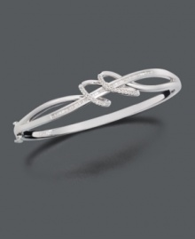 Let ribbons of silver and diamond unfurl at your wrist. This elegant bracelet features swirling sterling silver loops with channel-set and round-cut diamonds at the center. Approximate diameter: 2-3/4 inches. Let ribbons of silver and diamond unfurl at your wrist. This elegant bracelet features swirling sterling silver loops with channel-set and round-cut diamonds at the center. Approximate diameter: 2-3/4 inches.