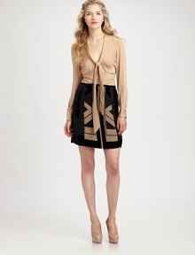 Intriguing seams adorn this tie-front silk blouse offering a hint of stretch for an impeccable fit.Tie neckLong sleevesButton frontIntricate pleatsCurved hemAbout 26 from shoulder to hemSilk/spandexDry cleanImported Model shown is 5'10 (177cm) wearing US size 4. Intriguing seams adorn this tie-front silk blouse offering a hint of stretch for an impeccable fit.Tie neckLong sleevesButton frontIntricate pleatsCurved hemAbout 26 from shoulder to hemSilk/spandexDry cleanImported Model shown is 5'10 (177cm) wearing US size 4.