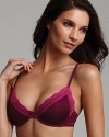 An ultra soft push-up bra with contrast lace trim and a wide scoop neckline, perfect for low-cut tops and dresses.