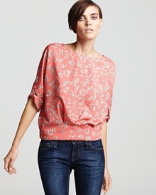 The charming print on this BCBGMAXAZRIA top marries with a blouson bodice and pleated hem for new-season femininity. Team it with skinnies and neutral sandals and look ladylike all through spring.