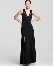Sheer lace details lend allure to a sophisticated BCBGMAXAZRIA gown. Sheer lace details lend allure to a sophisticated BCBGMAXAZRIA gown.
