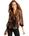 The look of the season, the bow-neck blouse, gets wild with a leopard-printed update from Baby Phat!