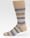 Colorful pattern is woven with a luxurious blend of stretch cotton.Mid-calf height45% cotton/44% nylon/8% other fibers/2% rubber/1% spandexMachine washImported