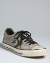 A distressed low-top sneaker that's vintage-inspired and qualitatively cool. From Converse by John Varvatos.