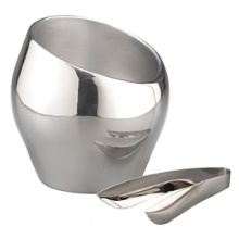Forged of lustrous, Nambé metal, this ice/champagne bucket exemplifies designer Todd Myers's artistic vision of eschewing straight lines. Instead, he presents a bulbous shape of soft curves highlighted by a radically tilted mouth that eases access to ice or allows a Champagne bottle to chill at a fetching angle. Accompanying the bucket are ice tongs, also forged in 18/10 stainless steel. Forged of lustrous, Nambé metal, this ice/champagne bucket exemplifies designer Todd Myers's artistic vision of eschewing straight lines. Instead, he presents a bulbous shape of soft curves highlighted by a radically tilted mouth that eases access to ice or allows a Champagne bottle to chill at a fetching angle. Accompanying the bucket are ice tongs, also forged in 18/10 stainless steel.