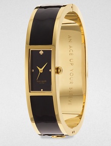 A chic enamel accented goldtone bangle timepiece. Quartz movementWater resistant to 3 ATMRectangular goldtone case, 16mm (0.6)Smooth bezelBlack dialDot hour markersSecond hand Enamel accented goldtone bangleImported A chic enamel accented goldtone bangle timepiece. Quartz movementWater resistant to 3 ATMRectangular goldtone case, 16mm (0.6)Smooth bezelBlack dialDot hour markersSecond hand Enamel accented goldtone bangleImported