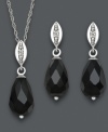 Dramatic drops add depth to your look. Faceted onyx (8 mm x 12 mm) and sparkling diamond accents adorn this matching pendant and drop earrings set. Crafted in sterling silver. Approximate length: 18 inches. Approximate pendant drop: 3/4 inch. Approximate earring drop: 3/4 inch.