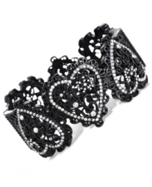 Heartfelt appreciation. This bangle bracelet from Betsey Johnson is crafted from black-plated mixed metal with glass crystal accents adding a lustrous touch. Approximate diameter: 2-3/8 inches. Heartfelt appreciation. This bangle bracelet from Betsey Johnson is crafted from black-plated mixed metal with glass crystal accents adding a lustrous touch. Approximate diameter: 2-3/8 inches.