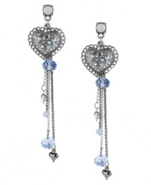 Fall in love with Betsey Johnson. These drop earrings feature silver tone heart charms accented by dangling chains, blue-colored crystals, blue faceted beads and silver tone bubble heart charms. Set in rhodium-plated mixed metal. Small crystal accent at post. Approximate drop: 3-1/2 inches. Fall in love with Betsey Johnson. These drop earrings feature silver tone heart charms accented by dangling chains, blue-colored crystals, blue faceted beads and silver tone bubble heart charms. Set in rhodium-plated mixed metal. Small crystal accent at post. Approximate drop: 3-1/2 inches.
