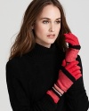 Hands look pretty in pink with these SONIA RYKIEL gloves, covered in colorblocked stripes of varying heights.