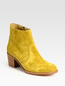 Ankle-grazing suede style with a stacked heel and convenient side zipper. Stacked heel, 2 (50mm)Suede upperSide zipperLeather lining and solePadded insoleImportedOUR FIT MODEL RECOMMENDS ordering true whole size; ½ sizes should order the next whole size up. Ankle-grazing suede style with a stacked heel and convenient side zipper. Stacked heel, 2 (50mm)Suede upperSide zipperLeather lining and solePadded insoleImportedOUR FIT MODEL RECOMMENDS ordering true whole size; ½ sizes should order the next whole size up.