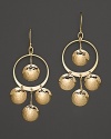 Hammered 14K. yellow gold discs dance and dangle from slim hoops.