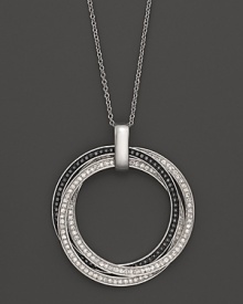 Faceted black and white diamonds set in gleaming 14K white gold. Faceted black and white diamonds set in gleaming 14K white gold.