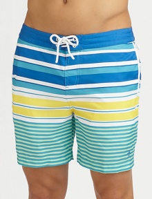 A quick-dry look with a colorful melange of printed stripes revive a classic beach style. Drawstring waistBack flap pocketsMesh liningInseam, about 6PolyesterMachine washImported A quick-dry look with a colorful melange of printed stripes revive a classic beach style. Drawstring waistBack flap pocketsMesh liningInseam, about 6PolyesterMachine washImported