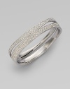 EXCLUSIVELY AT SAKS.COM. Curvaceous rows of pavé crystals decorate the wrist.Crystals Rhodium plated Width, about ¾ Diameter, about 2½ Push lock closure Imported