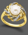 A cocktail ring that is anything but demure. Cultured freshwater pearl (7.5 mm) set against a 14k gold and diamond-accented weave steal the show.