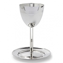 A new heritage piece for your family, this classic and elegant Kiddush cup & saucer set is crafted from Christofle silver. A new heritage piece for your family, this classic and elegant Kiddush cup & saucer set is crafted from Christofle silver.
