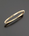 A perfect first bracelet, this small-sized bangle is made of delicately etched 14k gold in a flexible design.