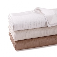 An abstract quilted pattern infuses this luxe HUGO BOSS coverlet with textural richness. An oversized silk border adds a crisp, elegant edge. An abstract quilted pattern infuses this luxe HUGO BOSS coverlet with textural richness. An oversized silk border adds a crisp, elegant edge.