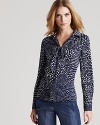 Whimsical polka dots infuse this '70s-inspired Tibi blouse with retro charm, creating a look rich with authenticity when you add the season's must-have flare jeans.