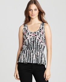 Downtown chic style is realized in this tribal Aqua top flaunting a ladylike peplum for a soft finish to the runway-inspired style. Downtown chic style is realized in this tribal Aqua top flaunting a ladylike peplum for a soft finish to the runway-inspired style.
