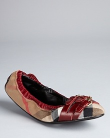 Burberry packs major style into slight ballerina flats, with a triple buckle detail and rich claret leather accents on a signature plaid backdrop. Burberry packs major style into slight ballerina flats, with a triple buckle detail and rich claret leather accents on a signature plaid backdrop.