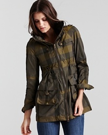 A rustic canvas green colorway feels crisp on an iconic anorak from Burberry. A rustic canvas green colorway feels crisp on an iconic anorak from Burberry.
