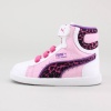 The girls' First Round is a classic basketball styled shoe offering one of Puma's most treasured styles.