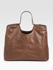 Leather in a cinched top handle carryall, embroidered with the YSL logo.Double top handles, 8½ dropProtective metal feetOne inside open pocketCotton lining17W X 10½H X 5DMade in Italy Leather in a cinched top handle carryall, embroidered with the YSL logo.Double top handles, 8½ dropProtective metal feetOne inside open pocketCotton lining17W X 10½H X 5DMade in Italy