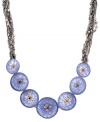 An artistic aesthetic. Textured purple disks accented by sparkling crystals take a fashion-forward approach on Kenneth Cole New York's stylish statement necklace. Featuring an array of chains, it's crafted in hematite tone mixed metal. Approximate length: 18 inches + 3-inch extender.