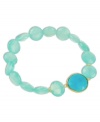 Ocean blue hues add an exotic touch to any look. This stunning stretch bracelet combines polished blue chalcedony (64 ct. t.w.) and turquoise (7-1/5 ct. t.w.) stones in an 18k gold over sterling silver setting. Bracelet stretches to fit wrist. Approximate length: 7-1/2 inches.