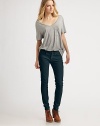 Ultra hip slim-fit style in a chic must-have shade.THE FITFitted through hips and thighsMedium rise, about 8Inseam, about 30THE DETAILSZip flyFive-pocket styleFront rivetsContrast logo embroidery at back patch pocket55% cotton/42% tencel/3% spandexDry cleanMade in USA of imported fabricModel shown is 5'9 (175cm) wearing US size 4.