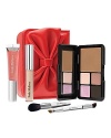 Featuring your total eye look, complexion pick-me-up, eye-area enhancer and moisturizing lip color plus the complementing brushes for a flawless application, this palm-sized collection is housed in Trish's irresistible bow-accented Portable Beauty case. Beauty Emergency™ Card Romance is packed with 4 universally flattering eye colors for everything from brightening to contouring and defining the eye plus the perfect all-the-time bronzer. Colors include: Eye Shadows Shell, Glaze Romance and Antique Rose, Eye Definer Deep Aubergine, and Bronzer Golden.Also includes: Instant Eye Lift under-eye brightener and line filler, deluxe travel size Beauty Booster Lip Gloss SPF 15 Sexy Petal, deluxe travel size Dual Ended Eye Brush featuring two of Trishs most iconic eye-enhancing brushes on opposing ends: Brush 50 Angled Eye Lining and Brush 23 Angled Crease Contour Brush 48 Blending: The perfect face color application and blending brush