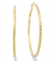 Classic chic. Every girl needs a polished pair of hoops like this traditional Giani Bernini style. Crafted in 24k gold over sterling silver with a unique textured surface. Approximate diameter: 2 inches. Approximate width: 1/10 inch.