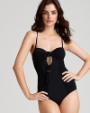 Show off your shape in a classically cut black swimsuit from Nanette Lepore.