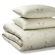 A delicate pattern of white flowers adorn the elegant branches on this Calvin Klein comforter set. The porcelain hue comforter and sham exude peaceful elegance and sweet dreams. A delicate pattern of white flowers adorn the elegant branches on this Calvin Klein comforter set. The porcelain hue comforter and sham exude peaceful elegance and sweet dreams.