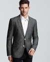A handsome, dapper sport coat for all occasions, work and play alike, with contrast buttons for a bit of designer pop.