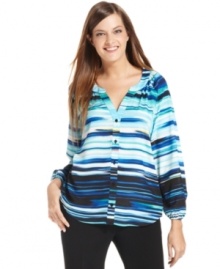 Calvin Klein's blouse features a blurred stripe print and relaxed fit for a feminine look. Calvin Klein's blouse features a blurred stripe print and relaxed fit for a feminine look.