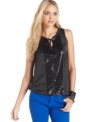 Add sparkle to your wardrobe in this sequin tank top from DKNY Jeans. It looks fantastic with the season's colored jeans!