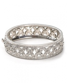 Say I do to sparkle. With a floral design and inset crystals, Carolee's silver bangle vows to wow. Say I do to sparkle. With a floral design and inset crystals, Carolee's silver bangle vows to wow.