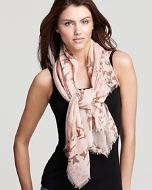 Flocks of birds and floral print decorate this elegant woven scarf from Fraas. Flocks of birds and floral print decorate this elegant woven scarf from Fraas.