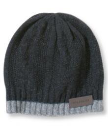 A rugged wool beanie with a look that harks back to the handmade, from Tommy Hilfiger. A rugged wool beanie with a look that harks back to the handmade, from Tommy Hilfiger.