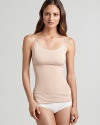 A basic spaghetti strap tank that will keep lines smooth and firm underneath the tightest tops. Adjustable straps and satin trim detail. Firm control tricot paneling comfortably smooths midsection. Minimizing panel shapes entire waistline from bust to hips. Exclusive dual fabric strategy provides a modern look and full coverage that stays in place. Great for layering over or tucking into pants and skirts.