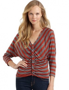 THE LOOKAllover stripesV-neckLong dolman sleevesChain link details down the centerPullover styleTHE FITAbout 22 from shoulder to hemTHE MATERIALRayon/polyesterCARE & ORIGINDry cleanMade in USAModel shown is 5'8 (172½cm) wearing US size Small. THE LOOKAllover stripesV-neckLong dolman sleevesChain link details down the centerPullover styleTHE FITAbout 22 from shoulder to hemTHE MATERIALRayon/polyesterCARE & ORIGINDry cleanMade in USAModel shown is 5'8 (172½cm) wearing US size Small.